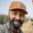 photo of man with beard wearing a hat